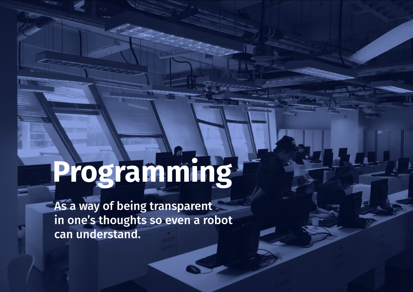 A photo by me, a computer class in Hong Kong Polytechnic University. A professor and students, computers.